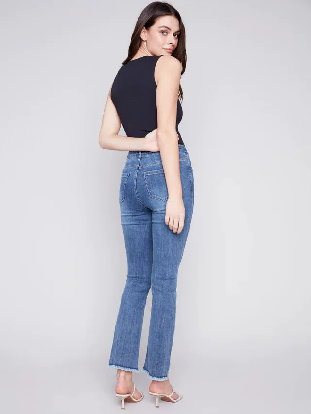 BOOTCUT JEANS WITH ASYMMETRICAL HEM